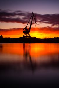Preview wallpaper construction, water, sunset, reflection