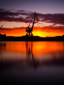 Preview wallpaper construction, water, sunset, reflection
