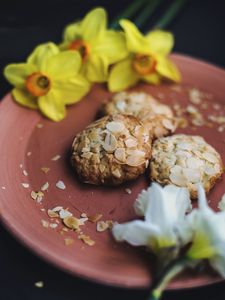 Preview wallpaper cookies, almonds, daffodils, flowers, plate