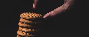 Preview wallpaper cookies, stack, dessert, hand, dark