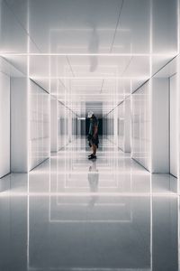 Preview wallpaper corridor, man, reflections, symmetry, minimalism