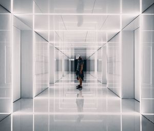 Preview wallpaper corridor, man, reflections, symmetry, minimalism