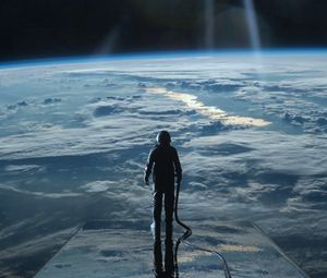 Preview wallpaper cosmonaut, space, planet, atmosphere, surface, glow