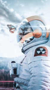 Preview wallpaper cosmonaut, spacesuit, butterfly, reflection, landscape, radioactive