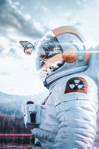 Preview wallpaper cosmonaut, spacesuit, butterfly, reflection, landscape, radioactive