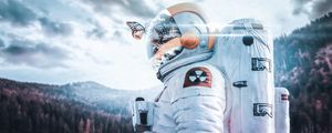 Preview wallpaper cosmonaut, spacesuit, butterfly, reflection, landscape, radioactive