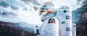 Preview wallpaper cosmonaut, spacesuit, butterfly, reflection, landscape, radioactive