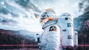 Preview wallpaper cosmonaut, spacesuit, butterfly, reflection, landscape, radioactive