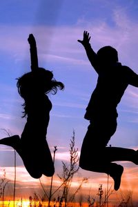 Preview wallpaper couple, jump, shadow, silhouette, grass, night