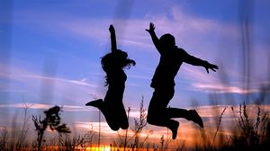 Preview wallpaper couple, jump, shadow, silhouette, grass, night