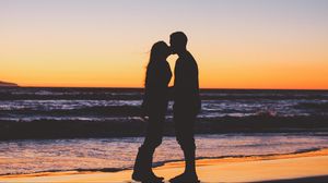 Preview wallpaper couple, kiss, sea, sunset, silhouettes