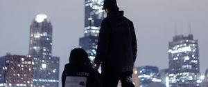 Preview wallpaper couple, roof, love, night city, skyscrapers, overview