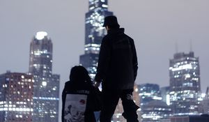 Preview wallpaper couple, roof, love, night city, skyscrapers, overview