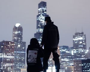Preview wallpaper couple, roof, love, night city, skyscrapers, overview