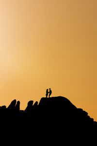 Preview wallpaper couple, silhouettes, hills, evening