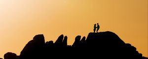 Preview wallpaper couple, silhouettes, hills, evening