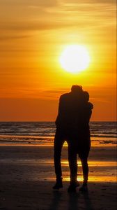 Preview wallpaper couple, silhouettes, hugs, beach, sunset, dark