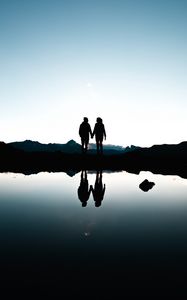 Preview wallpaper couple, silhouettes, reflection, sunset