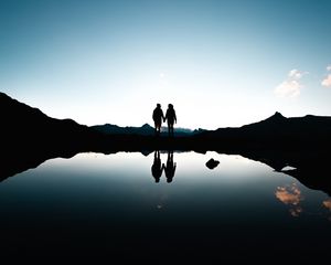 Preview wallpaper couple, silhouettes, reflection, sunset