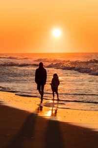 Preview wallpaper couple, silhouettes, sea, sunset, walk