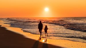 Preview wallpaper couple, silhouettes, sea, sunset, walk