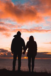 Preview wallpaper couple, silhouettes, sunset, sky