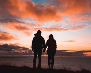 Preview wallpaper couple, silhouettes, sunset, sky