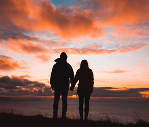 Preview wallpaper couple, silhouettes, sunset, sky
