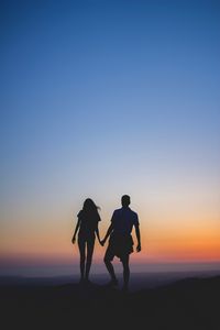 Preview wallpaper couple, silhouettes, sunset, love, horizon