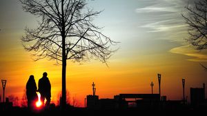 Preview wallpaper couple, silhouettes, sunset, walk, tree