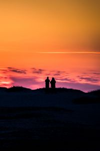 Preview wallpaper couple, silhouettes, sunset, dark