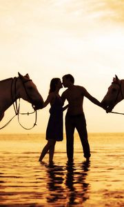 Preview wallpaper couple, sunset, sea, tenderness, horses, romance