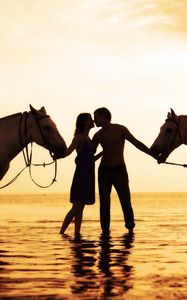 Preview wallpaper couple, sunset, sea, tenderness, horses, romance