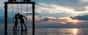 Preview wallpaper couple, swing, sea, romance, sunset, silhouettes