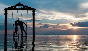 Preview wallpaper couple, swing, sea, romance, sunset, silhouettes