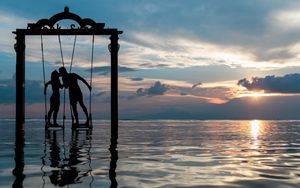 Preview wallpaper couple, swing, sea, romance, sunset, silhouettes