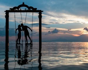 Preview wallpaper couple, swing, sea, romance, sunset, silhouettes