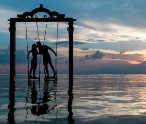 Preview wallpaper couple, swing, sea, romance, sunset, silhouettes