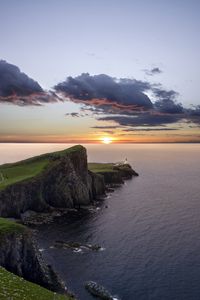 Preview wallpaper crag, sunset, lighthouse, sea, horizon