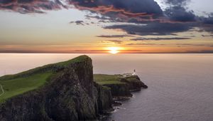 Preview wallpaper crag, sunset, lighthouse, sea, horizon