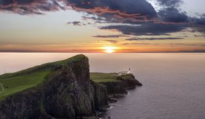 Preview wallpaper crag, sunset, lighthouse, sea, horizon