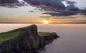 Preview wallpaper crag, sunset, lighthouse, sea, horizon