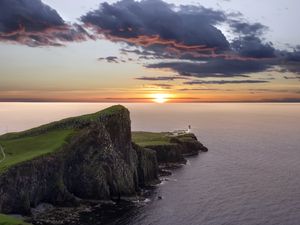 Preview wallpaper crag, sunset, lighthouse, sea, horizon
