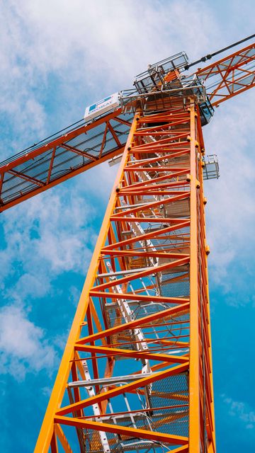 360x640 Wallpaper crane, construction, clouds, sky, height