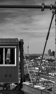 Preview wallpaper crossbar, railway carriage, tower, buildings, city, bw