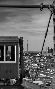 Preview wallpaper crossbar, railway carriage, tower, buildings, city, bw