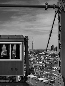 Preview wallpaper crossbar, railway carriage, tower, buildings, city, bw