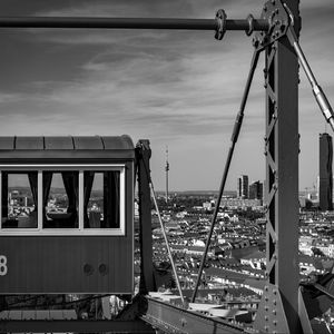 Preview wallpaper crossbar, railway carriage, tower, buildings, city, bw