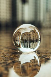 Preview wallpaper crystal ball, ball, buildings, water, reflection