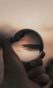 Preview wallpaper crystal ball, ball, hand, reflection, illusion